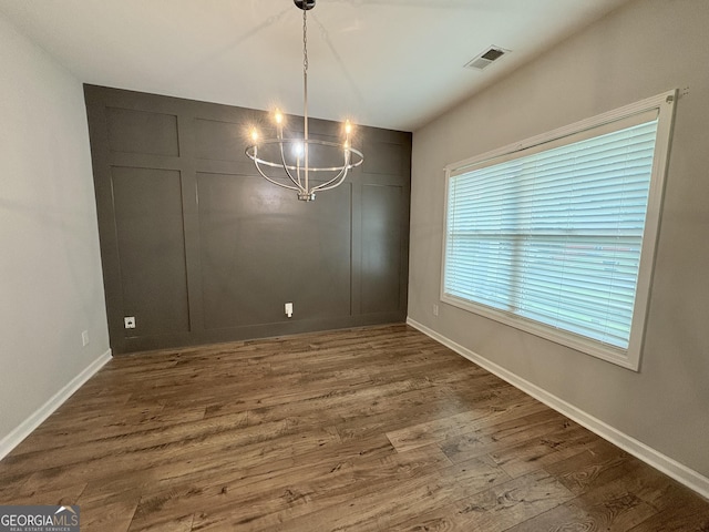 248 Webster Lake Dr, Temple, GA 30179 - unfurnished dining area with a chandelier and wood finished floors