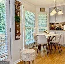 507 Legacy Park Ln, Powder Springs, GA 30127 - dining area with plenty of natural light and light wood finished floors