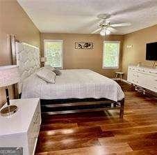 507 Legacy Park Ln, Powder Springs, GA 30127 - bedroom featuring dark wood-style floors