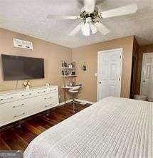 507 Legacy Park Ln, Powder Springs, GA 30127 - bedroom with hardwood / wood-style floors and a ceiling fan
