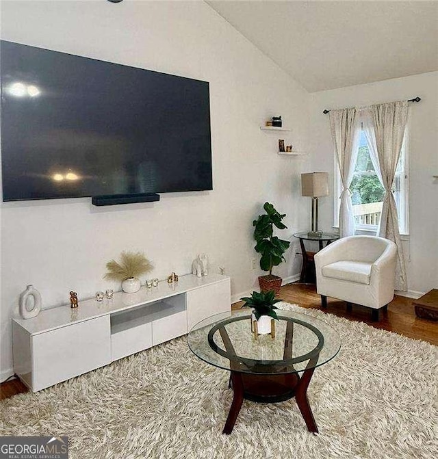 507 Legacy Park Ln, Powder Springs, GA 30127 - living area featuring wood finished floors and lofted ceiling