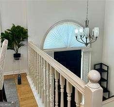 507 Legacy Park Ln, Powder Springs, GA 30127 - hallway featuring a chandelier and wood finished floors