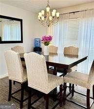507 Legacy Park Ln, Powder Springs, GA 30127 - dining area with a chandelier and baseboards