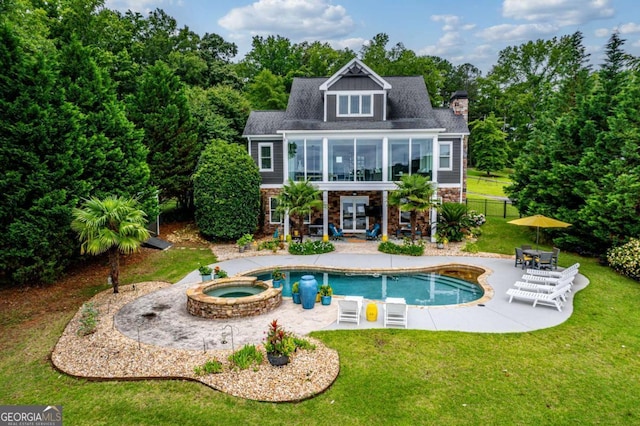 202 Jackson Rd SE, Milledgeville, GA 31061 - back of house featuring a patio area, french doors, a chimney, stone siding, and a pool with connected hot tub
