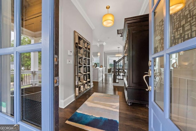 202 Jackson Rd SE, Milledgeville, GA 31061 - entryway featuring crown molding, healthy amount of natural light, dark wood-type flooring, and stairs
