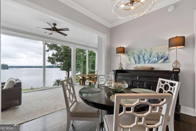 202 Jackson Rd SE, Milledgeville, GA 31061 - dining area with wood finished floors, ceiling fan, a water view, crown molding, and a chandelier