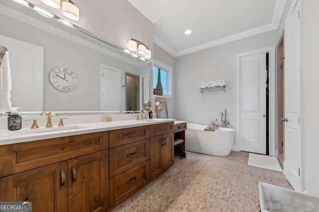 202 Jackson Rd SE, Milledgeville, GA 31061 - bathroom with double vanity, a freestanding tub, crown molding, and recessed lighting