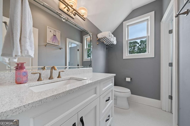 202 Jackson Rd SE, Milledgeville, GA 31061 - bathroom with vanity, lofted ceiling, and healthy amount of natural light