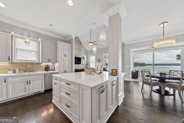 202 Jackson Rd SE, Milledgeville, GA 31061 - kitchen with a chandelier, stainless steel dishwasher, light countertops, hanging light fixtures, and lofted ceiling