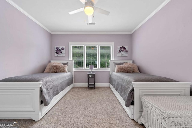 202 Jackson Rd SE, Milledgeville, GA 31061 - bedroom with light colored carpet, crown molding, and a ceiling fan