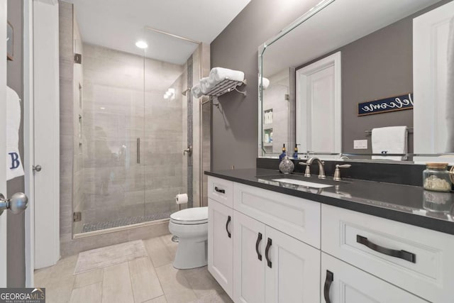202 Jackson Rd SE, Milledgeville, GA 31061 - bathroom with a shower stall, vanity, tile patterned floors, and recessed lighting