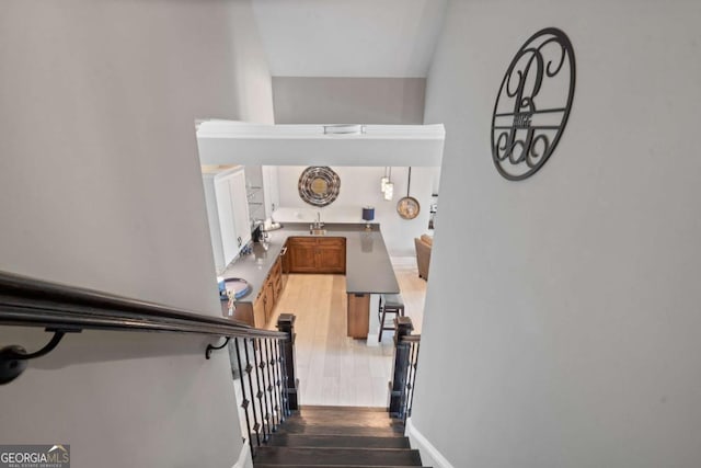 202 Jackson Rd SE, Milledgeville, GA 31061 - stairs featuring wood finished floors