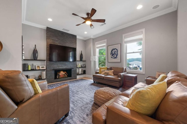 202 Jackson Rd SE, Milledgeville, GA 31061 - living room featuring ceiling fan, a stone fireplace, recessed lighting, and ornamental molding