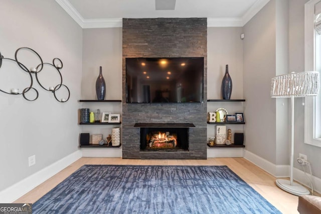 202 Jackson Rd SE, Milledgeville, GA 31061 - living room featuring a stone fireplace, ornamental molding, and wood finished floors
