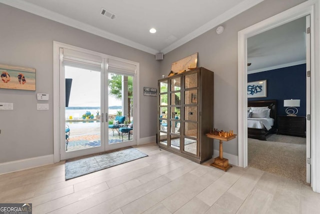202 Jackson Rd SE, Milledgeville, GA 31061 - doorway to outside with crown molding, french doors, recessed lighting, and light wood finished floors