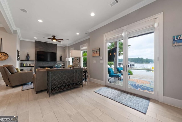202 Jackson Rd SE, Milledgeville, GA 31061 - living room with recessed lighting, a ceiling fan, ornamental molding, and light wood-type flooring