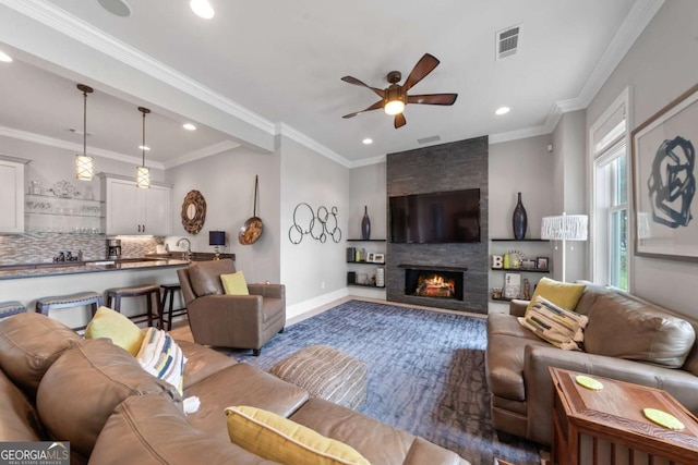 202 Jackson Rd SE, Milledgeville, GA 31061 - living area featuring ceiling fan, recessed lighting, a fireplace, and crown molding