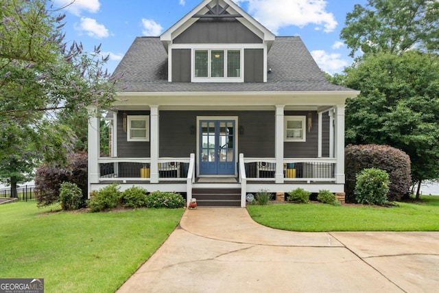 202 Jackson Rd SE, Milledgeville, GA 31061 - bungalow-style house with a front lawn, covered porch, and roof with shingles