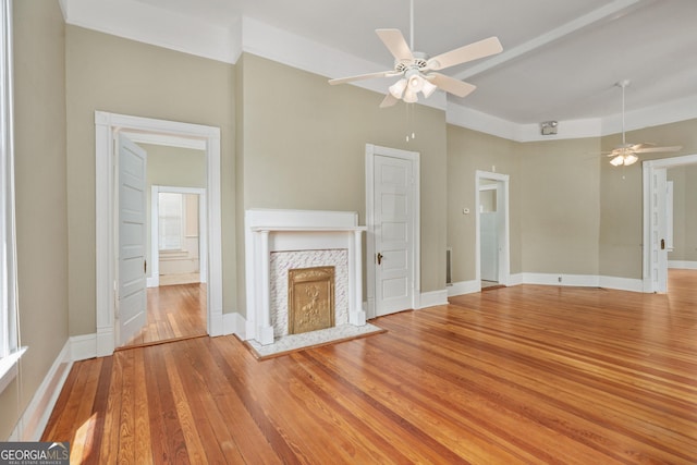 124 Hines Ter, Macon, GA 31204 - unfurnished living room with a ceiling fan, light wood-style floors, and a fireplace