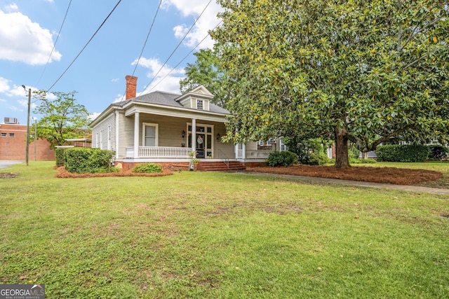 124 Hines Ter, Macon, GA 31204 - view of front of home featuring covered porch, a front lawn, and a chimney