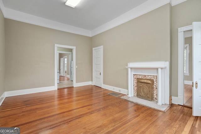 124 Hines Ter, Macon, GA 31204 - unfurnished living room featuring wood finished floors and a fireplace
