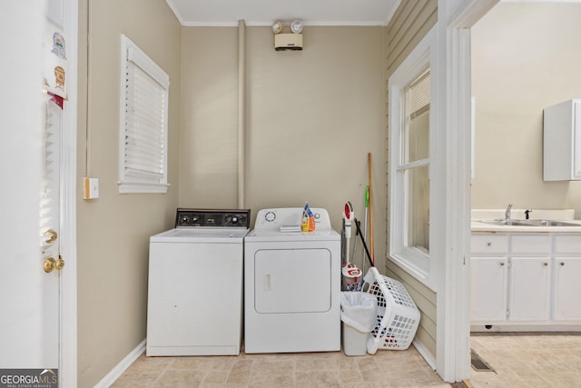 124 Hines Ter, Macon, GA 31204 - laundry room with washing machine and dryer and crown molding