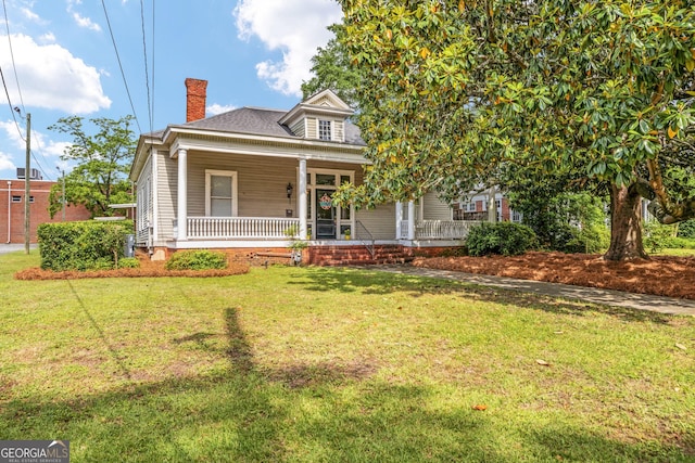 124 Hines Ter, Macon, GA 31204 - view of front of property featuring a chimney, a porch, and a front yard