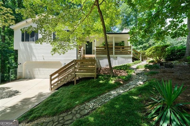 86 Kelly, Dallas, GA 30157 - view of front of home featuring concrete driveway, an attached garage, a porch, and stairs