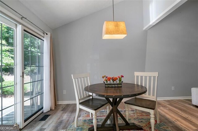 86 Kelly, Dallas, GA 30157 - dining room featuring wood finished floors and vaulted ceiling
