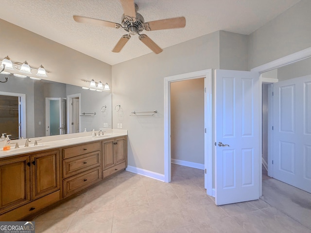 152 Huron Loop, Brunswick, GA 31523 - full bath with double vanity, ceiling fan, a textured ceiling, and tile patterned flooring