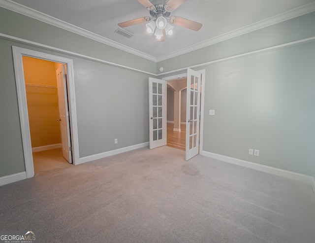 152 Huron Loop, Brunswick, GA 31523 - carpeted empty room with french doors, ornamental molding, and ceiling fan