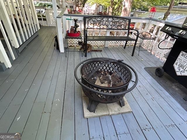 39 Terrace Cir, Cleveland, GA 30528 - wooden deck with a fire pit