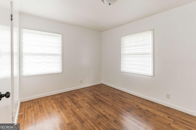 1784 Treymire Ct, Stone Mountain, GA 30088 - unfurnished room featuring hardwood / wood-style flooring and baseboards