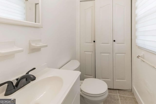 1784 Treymire Ct, Stone Mountain, GA 30088 - half bathroom with a closet, tile patterned floors, and vanity