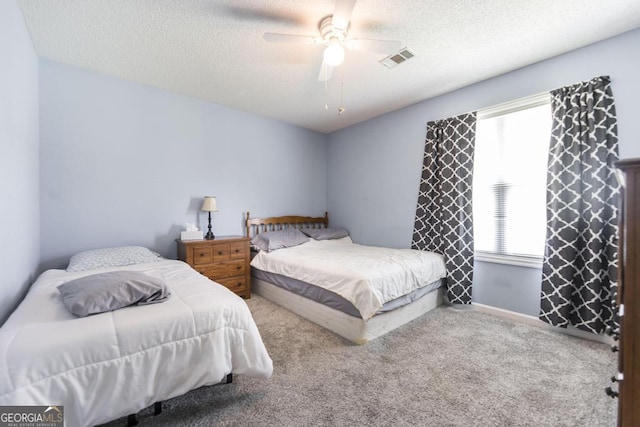 105 Shadow Ln, Warner Robins, GA 31088 - carpeted bedroom with a textured ceiling and a ceiling fan