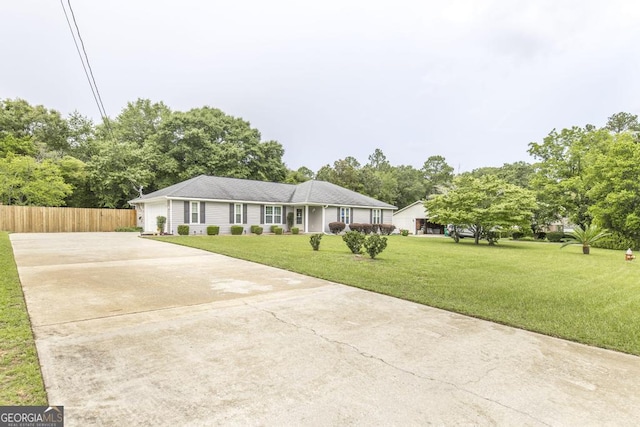 105 Shadow Ln, Warner Robins, GA 31088 - single story home with driveway and view of scattered trees
