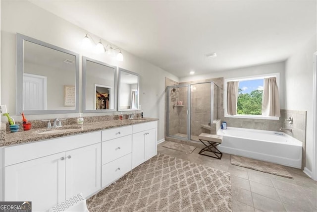 349 Garnet Dr, Acworth, GA 30101 - bathroom with a shower stall, a bath, double vanity, and tile patterned floors