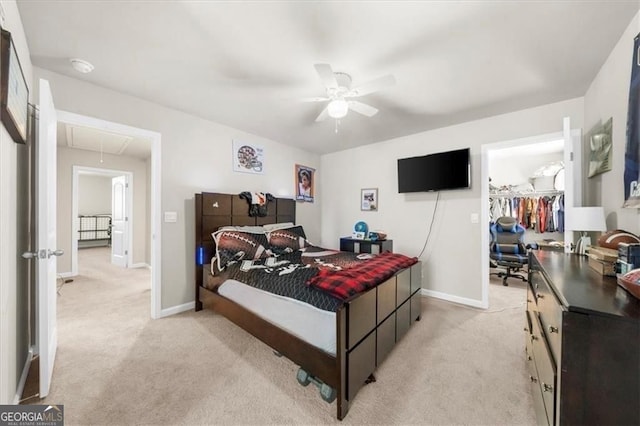 349 Garnet Dr, Acworth, GA 30101 - bedroom with attic access, light carpet, a spacious closet, and a ceiling fan