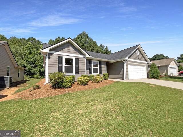 651 Walnut Woods Dr, Braselton, GA 30517 - ranch-style house with an attached garage, driveway, a front yard, and a shingled roof