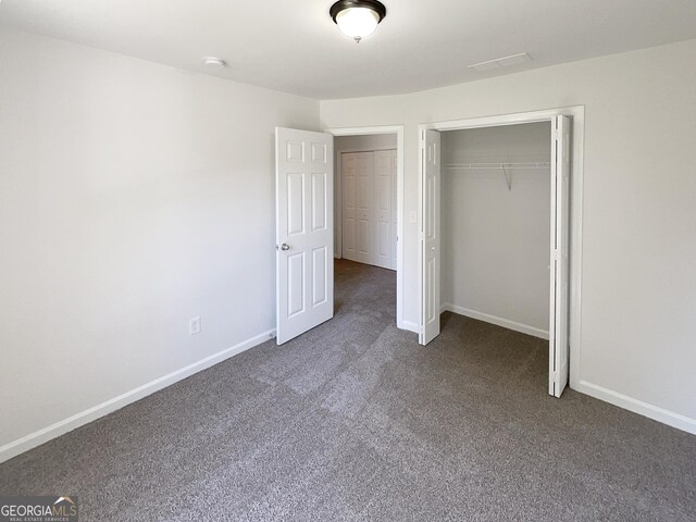 651 Walnut Woods Dr, Braselton, GA 30517 - unfurnished bedroom with carpet and a closet