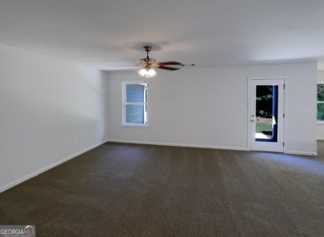 651 Walnut Woods Dr, Braselton, GA 30517 - empty room featuring dark carpet and a ceiling fan