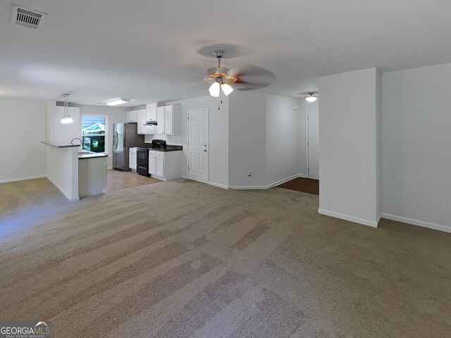 651 Walnut Woods Dr, Braselton, GA 30517 - unfurnished living room with light colored carpet and a ceiling fan