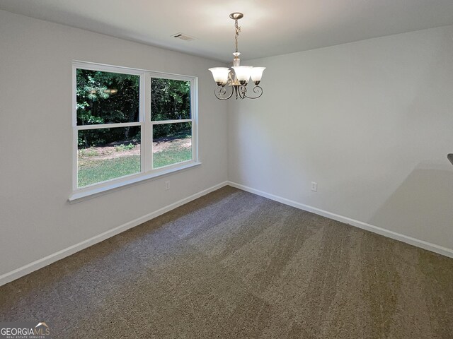 651 Walnut Woods Dr, Braselton, GA 30517 - unfurnished room featuring a chandelier and dark colored carpet