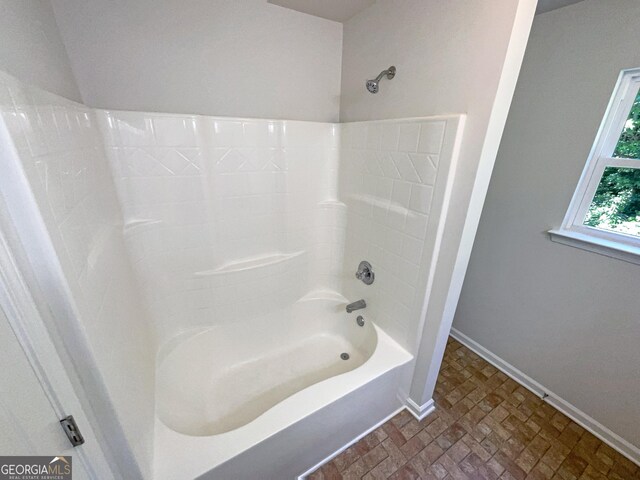 651 Walnut Woods Dr, Braselton, GA 30517 - bathroom featuring baseboards and bathing tub / shower combination