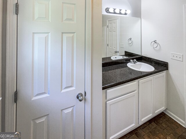 651 Walnut Woods Dr, Braselton, GA 30517 - bathroom featuring vanity and baseboards