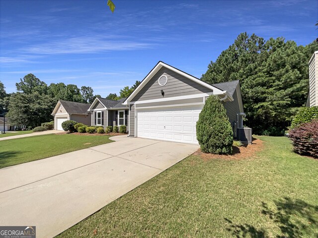 651 Walnut Woods Dr, Braselton, GA 30517 - ranch-style house featuring a garage, driveway, and a front yard