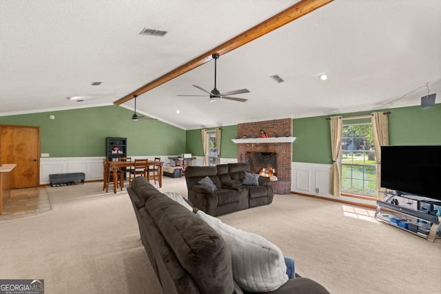 310 Ridge Rd, Kingsland, GA 31548 - living room with carpet flooring, a wainscoted wall, a decorative wall, ceiling fan, and a fireplace