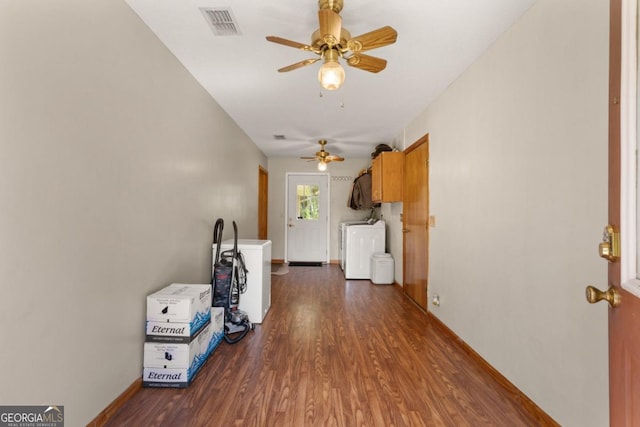 310 Ridge Rd, Kingsland, GA 31548 - unfurnished living room with washer / dryer, ceiling fan, and dark wood-style flooring