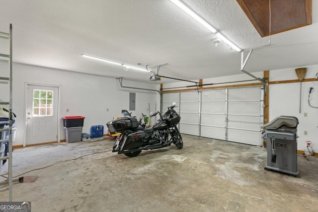 310 Ridge Rd, Kingsland, GA 31548 - garage featuring electric panel and a garage door opener