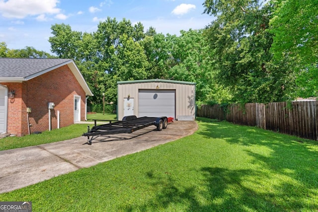 310 Ridge Rd, Kingsland, GA 31548 - view of yard with concrete driveway, an outbuilding, and a detached garage